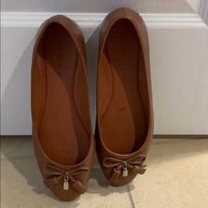 Coach tan flats. Feel free to make an offer.